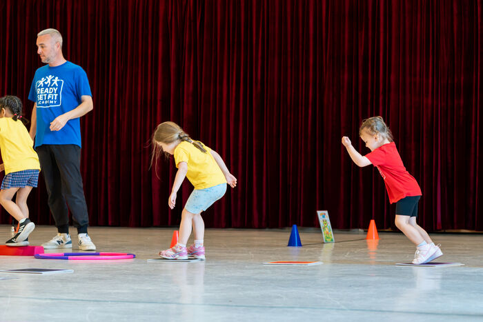 Preschoolers weaving between cones during a Ready Set Fit class