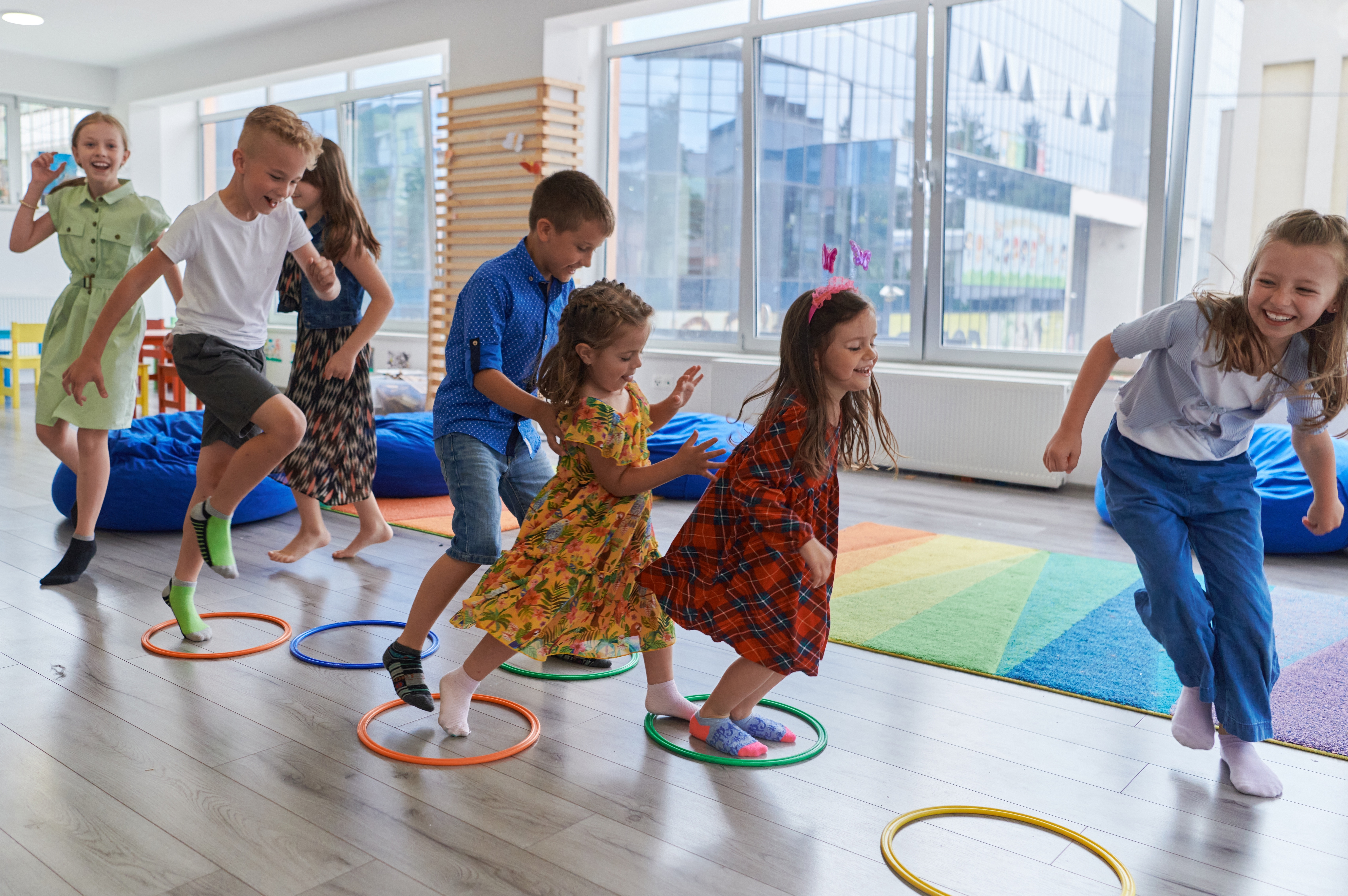 Kids playing with hula hoops in a Ready Set Fit fitness class